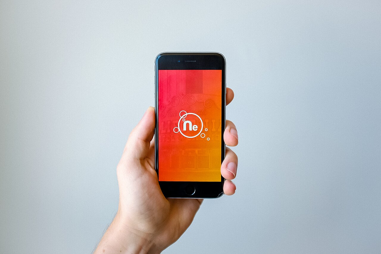 A close-up of a hand holding a smartphone